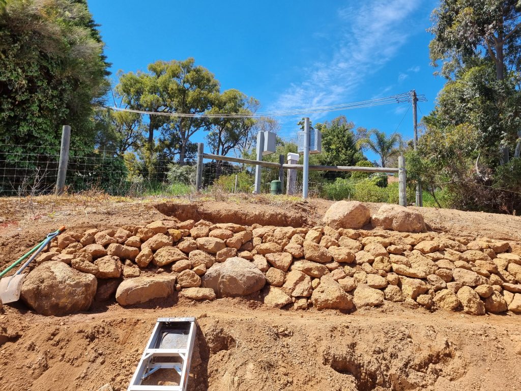 Stone pitching retaining walls.